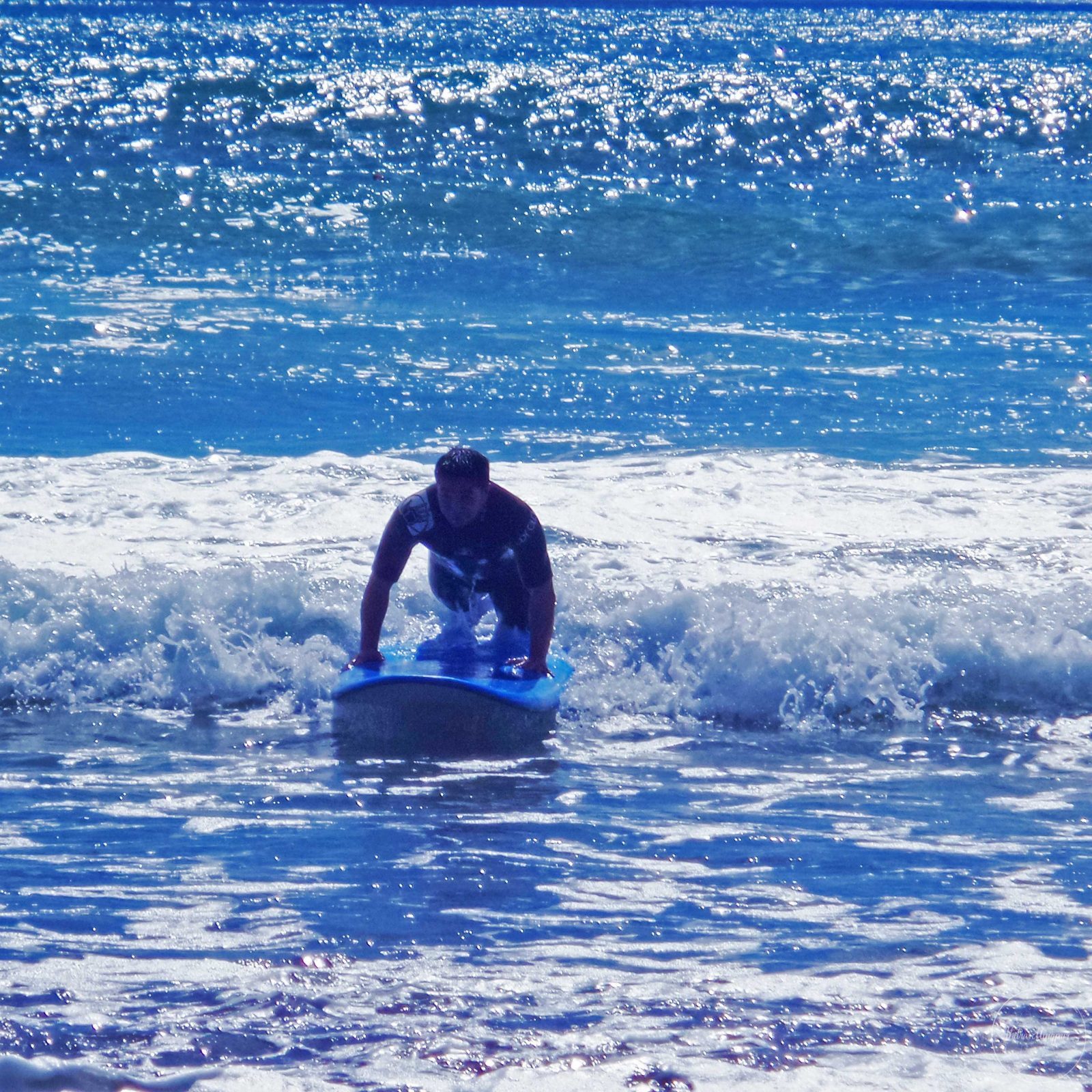 Surfing at Sandy Bay